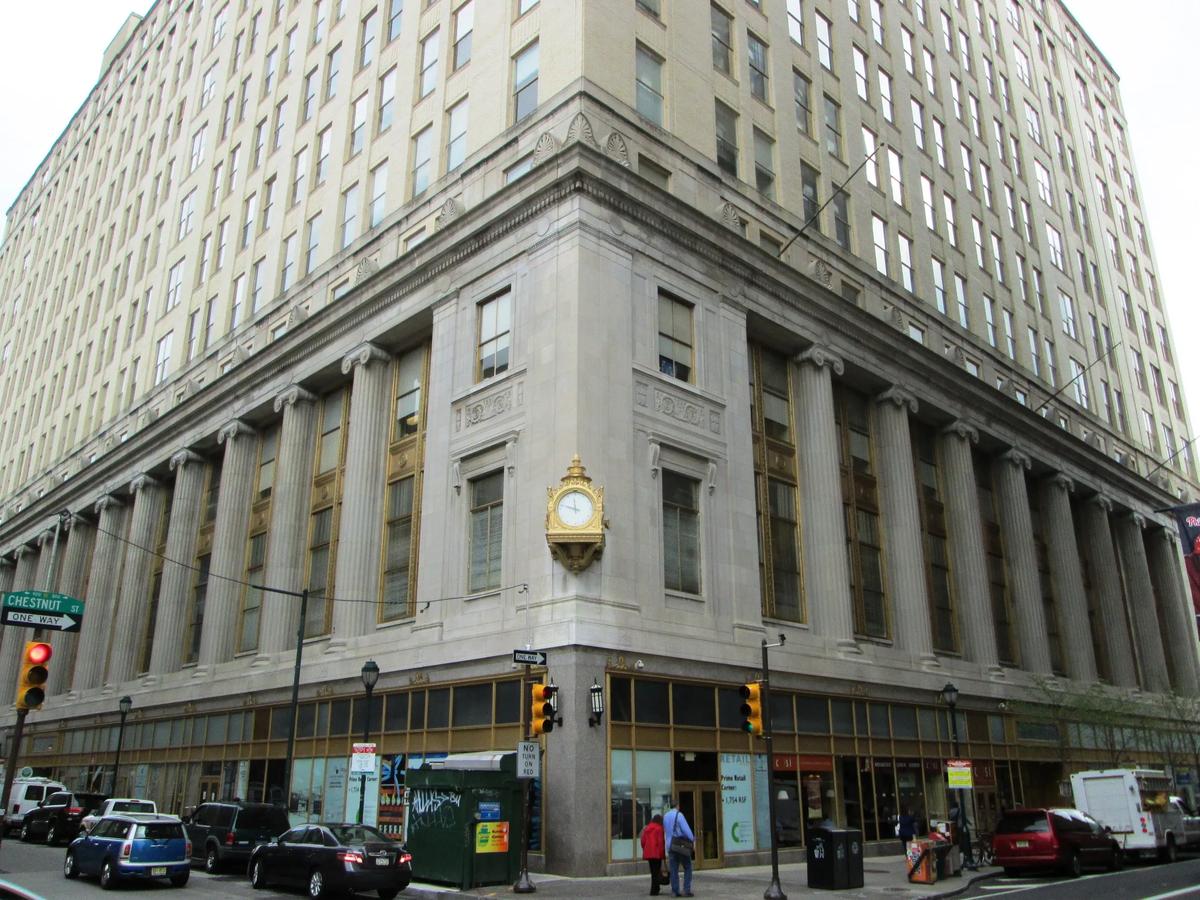 a building with a clock on the corner