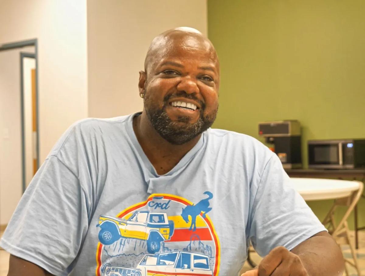 a man smiling at camera