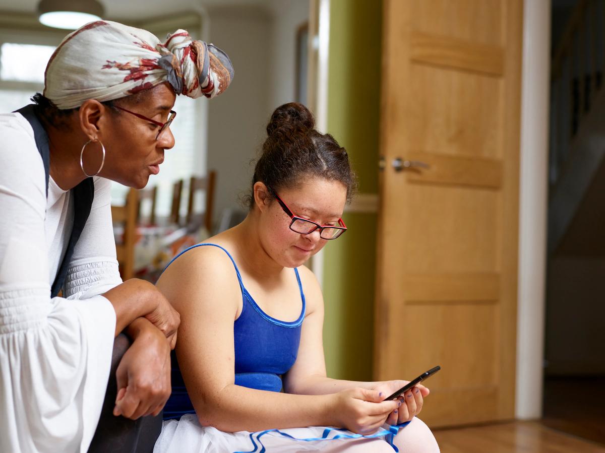 a woman looking at a phone