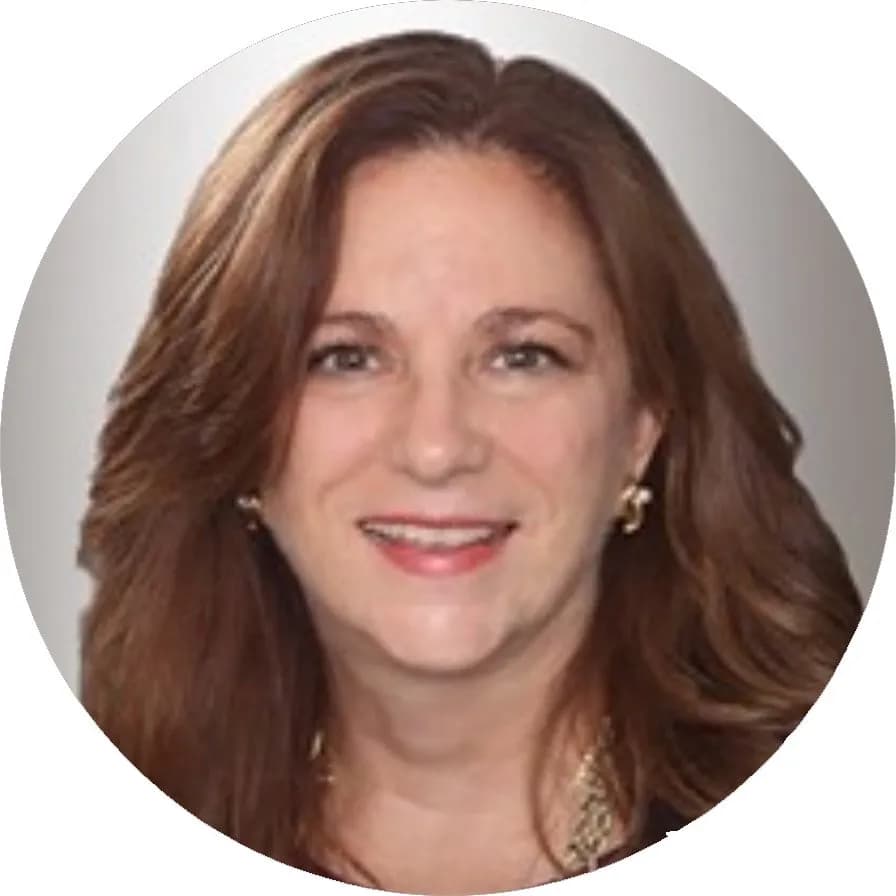 Lora Lahoda, Board Member at Mental Health Partnerships, smiling with long brown hair and a navy blazer.