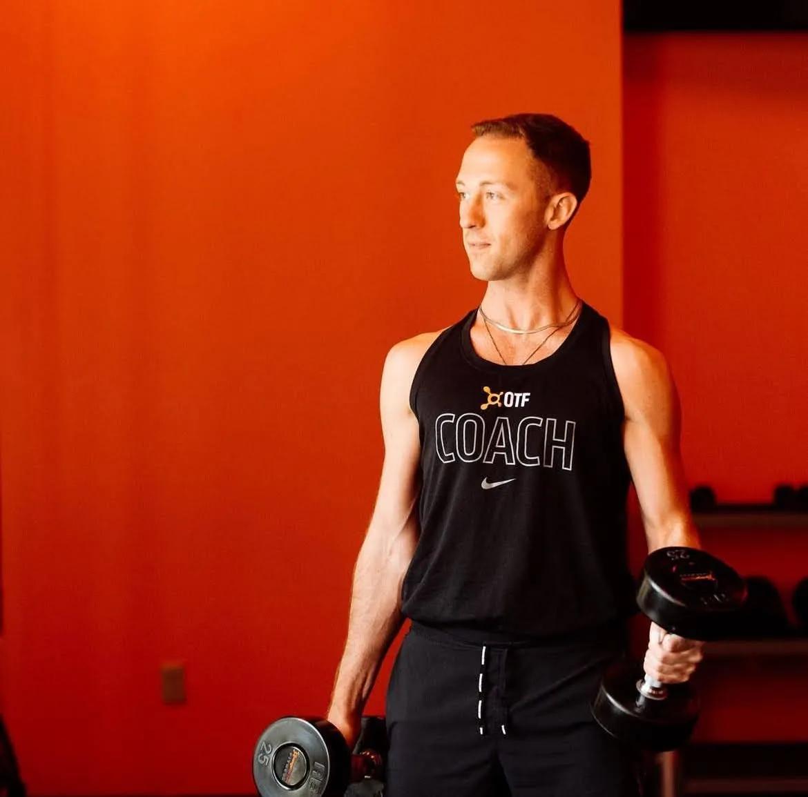 Person lifting weights representing the connection between physical fitness and mental well-being