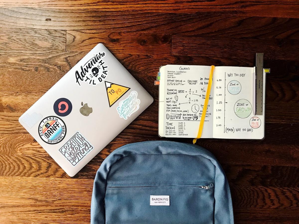 College student preparing for a new semester with a mental health checklist on a desk