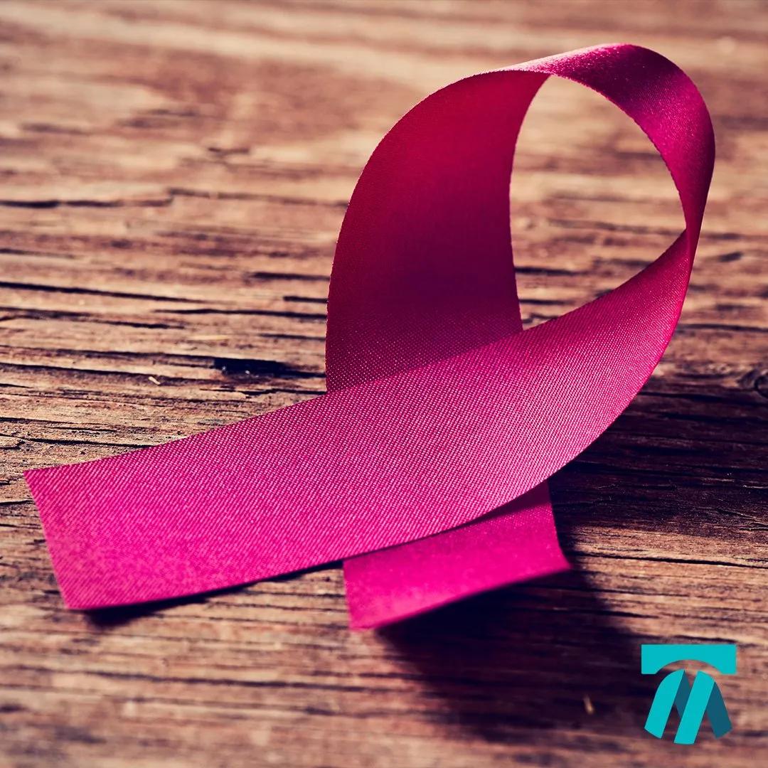 Pink cancer ribbon with support resources for those caring for loved ones with cancer