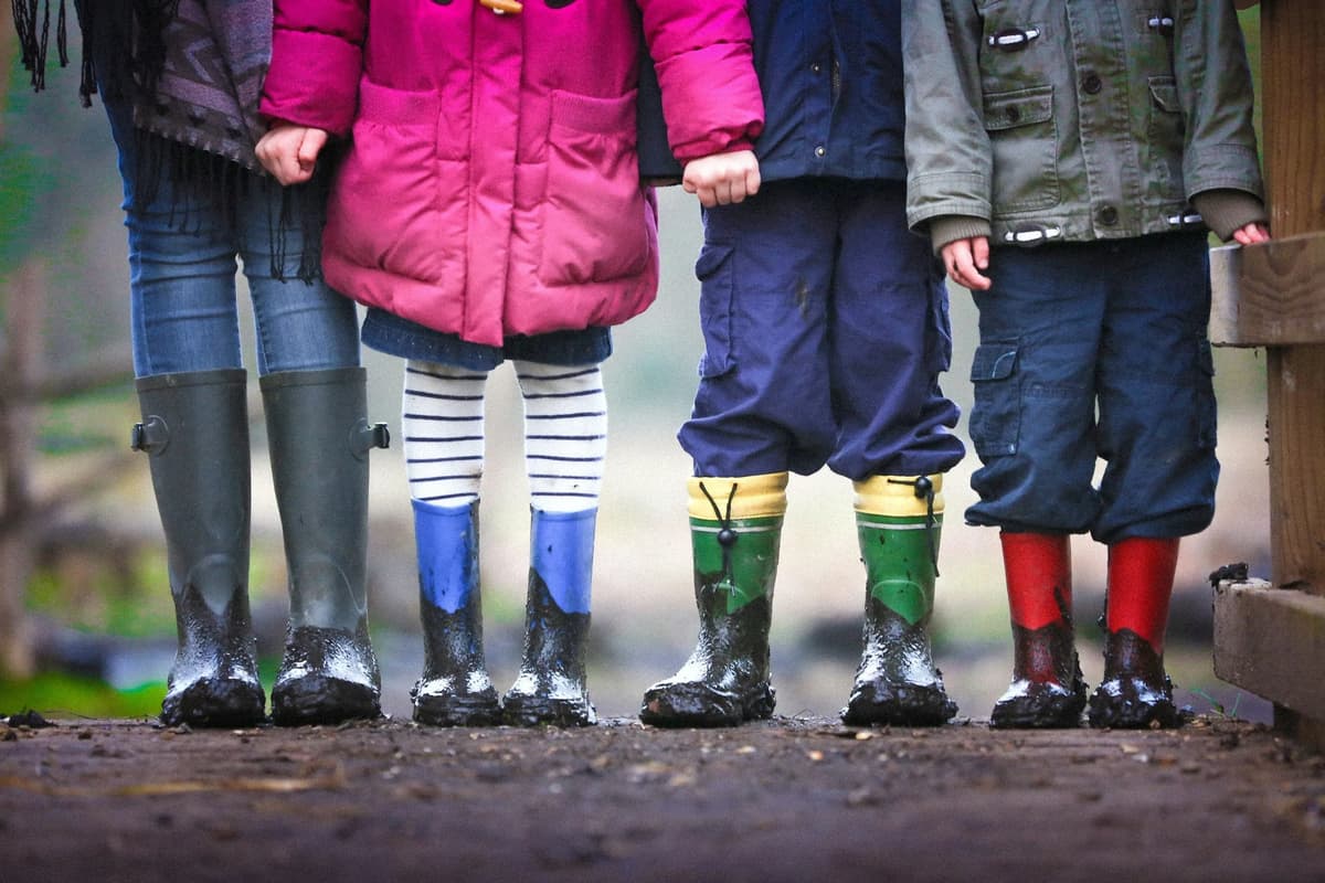Children standing together outdoors symbolizing unity in response to youth mental health crisis
