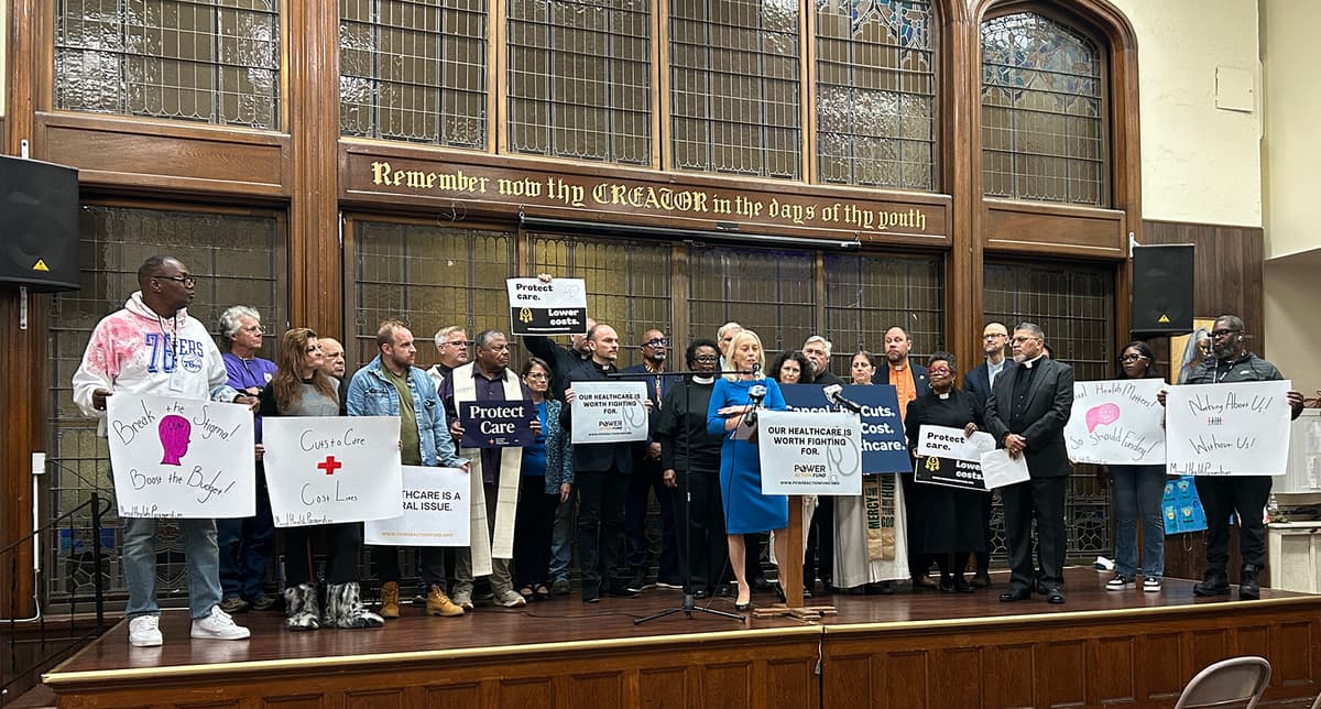 An image displaying a group of advocates at city hall rallying for SNAP